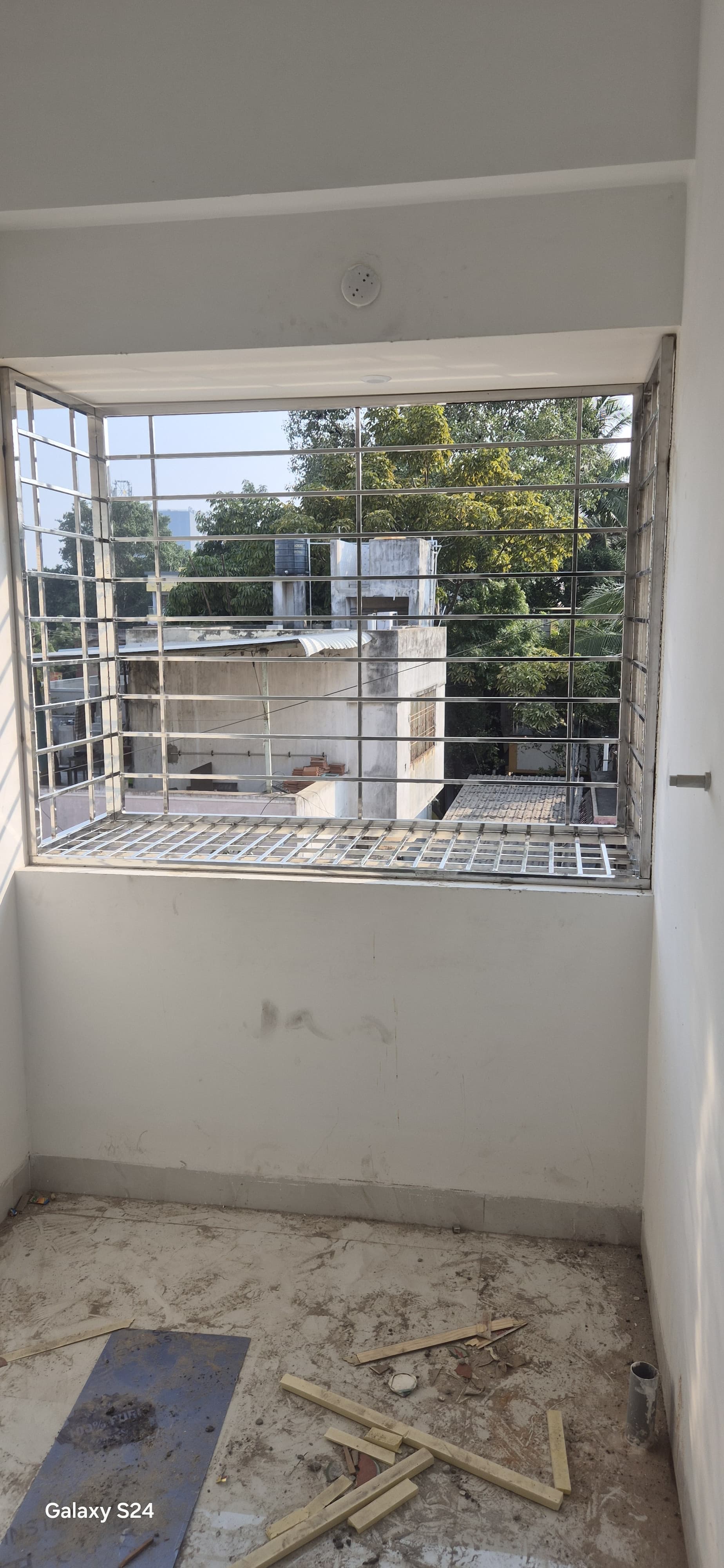 Architectural stainless steel window safety grill on modern house facade